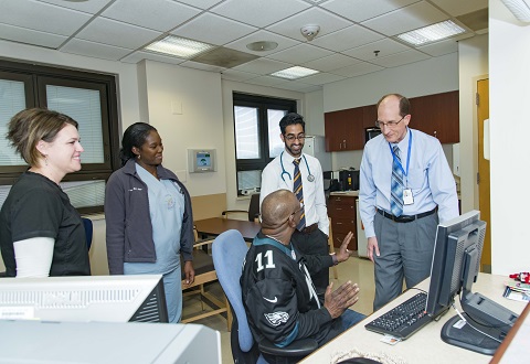 Sleep Center staff with Army Veteran and patient